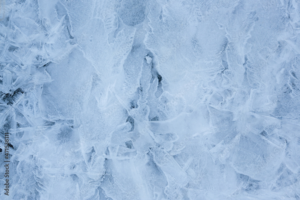 Ice texture. Beautiful winter frosty background. Cool ice patterns on the frozen surface of the water. Cold weather and frost. Winter season. Perfect background for Christmas and New Year holidays. Ice texture. Beautiful winter frosty background. Cool ice patterns on the frozen surface of the water. Cold weather and frost. Winter season. Perfect background for Christmas and New Year holidays.