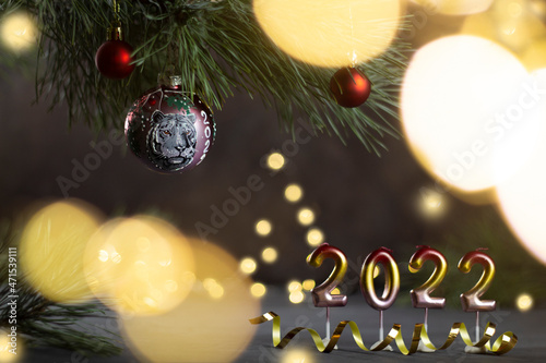 2022. Symbol of the year of the tiger according to the lunar Chinese calendar. Year of the Tiger. Christmas background with Christmas decorations. Copy space photo