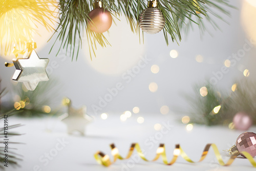 Christmas background with Christmas decorations, green spruce branches. Christmas background. Bokeh. Festive Christmas card. Selective focus. Copy space