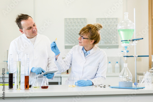 Two scientists working with terpene crystals in laboratory