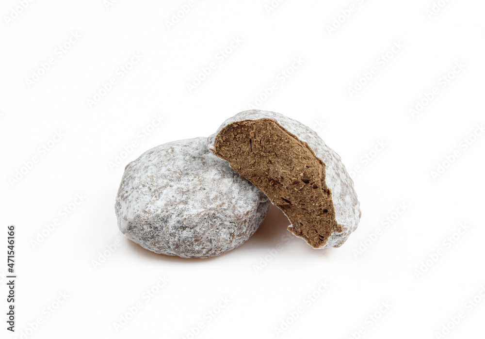 Two belgian truffles covered with powder isolated on white background Two belgian truffles covered with powder isolated on white background