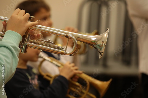 Tablou canvas Jazz band of young musicians boys and girls playing the trumpet random shot at a