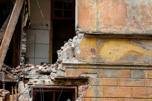 Fragment of old destroyed brick house. Demolition of dilapidated housing, renovation concept