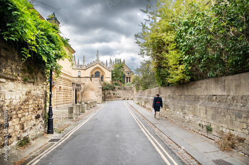 Woman walking in the street in Oxford England