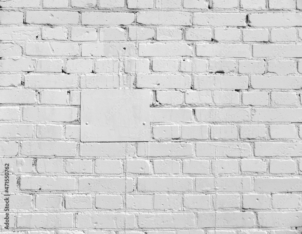 Old Brick wall painted with white paint and white plate. Old Brick wall painted with white paint and white plate.