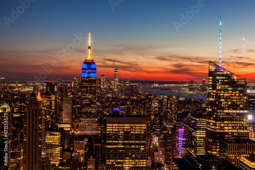 View of Manhattan looking out over the Empire State Building  One World Trade Center and the Statue of Liberty
