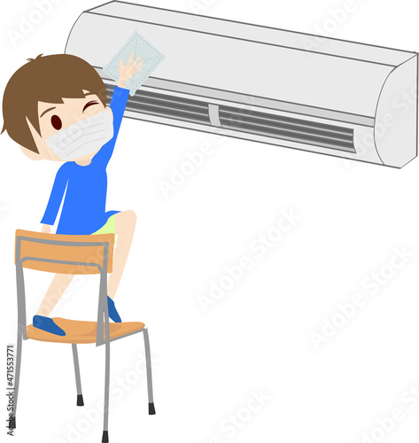 エアコンを清掃する男の子