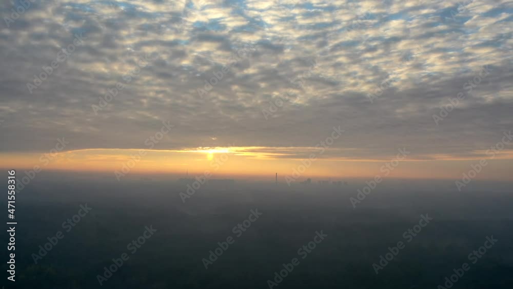 Bright dawn sky with low clouds. Timelapse drone view. Bright dawn sky with low clouds. Timelapse drone view.