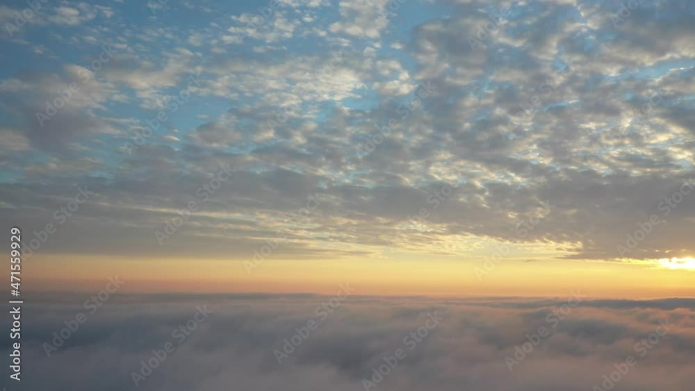 Dawn over the clouds. View from a passenger plane. Dawn over the clouds. View from a passenger plane.