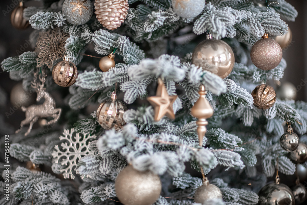 Close-up of a festively decorated outdoor Christmas tree with balls on a blurred sparkling fairy background. Defocused garland lights, bokeh effect. Close-up of a festively decorated outdoor Christmas tree with balls on a blurred sparkling fairy background. Defocused garland lights, bokeh effect.