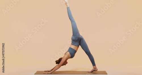 Yoga pilates stretching workout. Fit young slim girl doing splits exercise for god flexibility and wellness in studio.