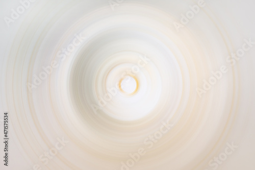 Glowing light beige and yellow circular blur
