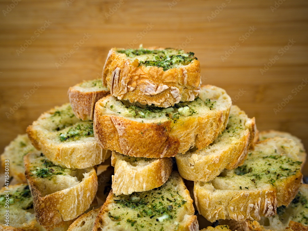 Pyramid of French baked baguettes with garlic butter Pyramid of French baked baguettes with garlic butter