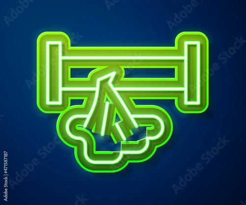 Glowing neon line Broken metal pipe with leaking water icon isolated on blue background. Vector