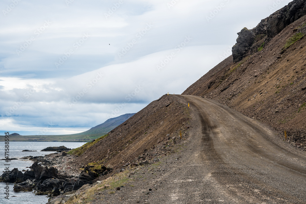Road through the landslides of Urdarfjall mountain in Nordurfjordur in Iceland