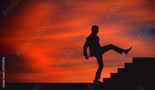 Fototapeta Naklejka Na Ścianę i Meble -  Young Businessman Trying To Climb the stair in one Big Step Skipping the small steps. Ambition business man Skips stairs to get the top faster. Silhouette in Beautiful Orange Sunset background. 
