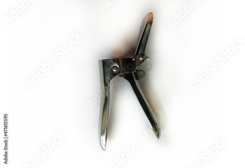 Gynecologic speculum on a white background. Cusco's vaginal Speculum for examination of vagina. medical, surgical instruments.  photo