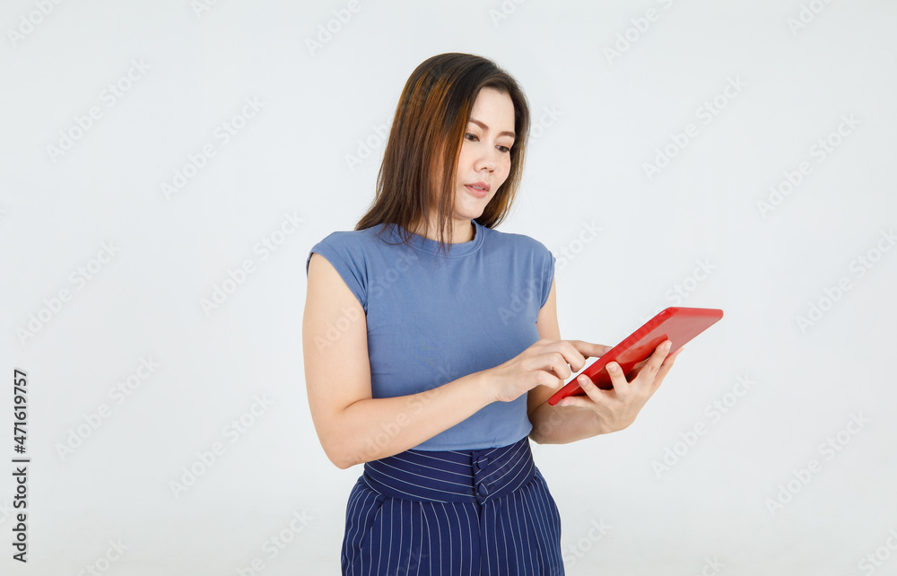 Charming Asian woman hold tablet and attentively typing message for online internet info searching, business news check and communication. Comfortable mobile computer for casual working lifestyle Charming Asian woman hold tablet and attentively typing message for online internet info searching, business news check and communication. Comfortable mobile computer for casual working lifestyle