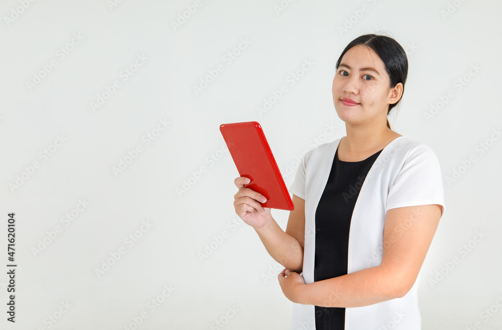 Charming Asian woman hold tablet and looking for online internet info searching, business news check and communication. Comfortable mobile computer for casual working lifestyle Charming Asian woman hold tablet and looking for online internet info searching, business news check and communication. Comfortable mobile computer for casual working lifestyle