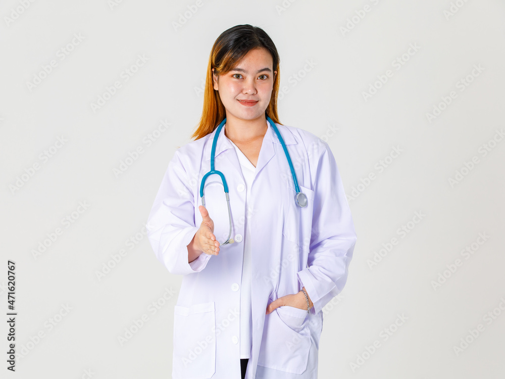 Portrait studio shot of Asian successful professional female clinical doctor in lab coat uniform hanging stethoscope around neck standing smiling and give hand for shaking Portrait studio shot of Asian successful professional female clinical doctor in lab coat uniform hanging stethoscope around neck standing smiling and give hand for shaking