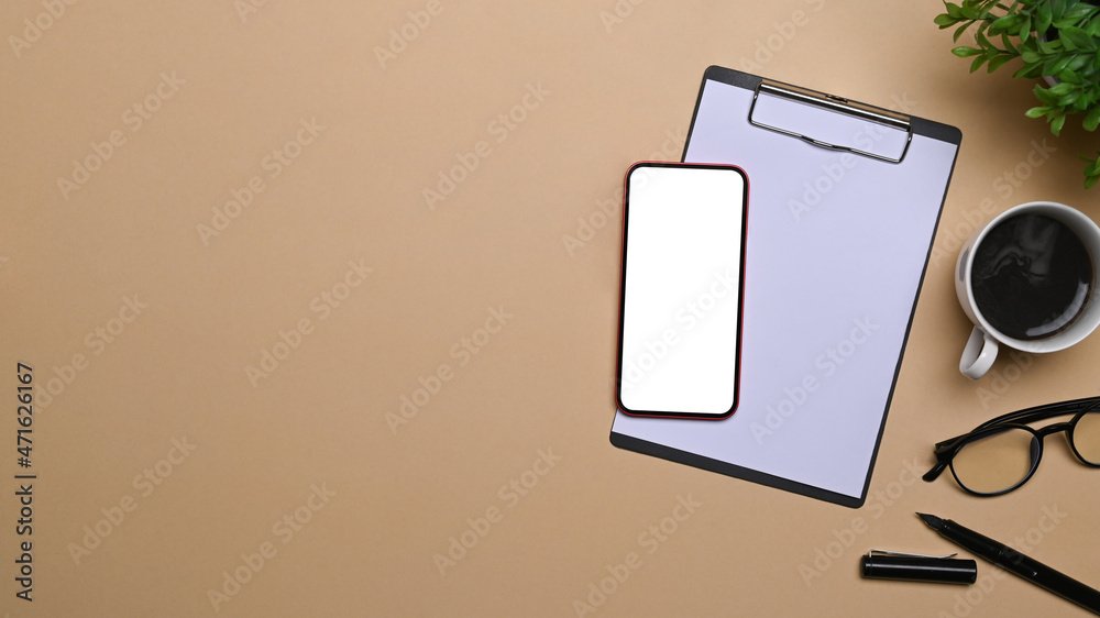 Top view mock up smart phone, clipboard and coffee cup on beige background. Top view mock up smart phone, clipboard and coffee cup on beige background.