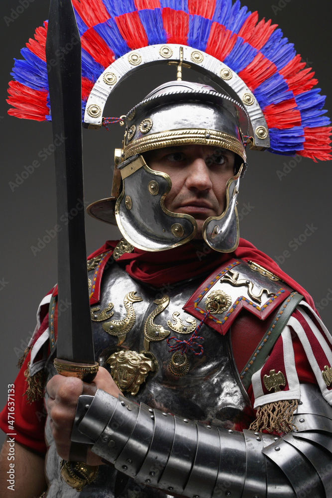 Εκτύπωση καμβά Combative roman centurion dressed in armor holding gladius