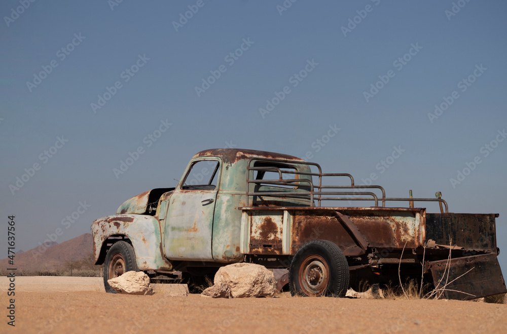 Old rusty car abandoned in the middle of the Namib desert