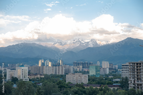 mountains and sky in the city against the background of buildings.