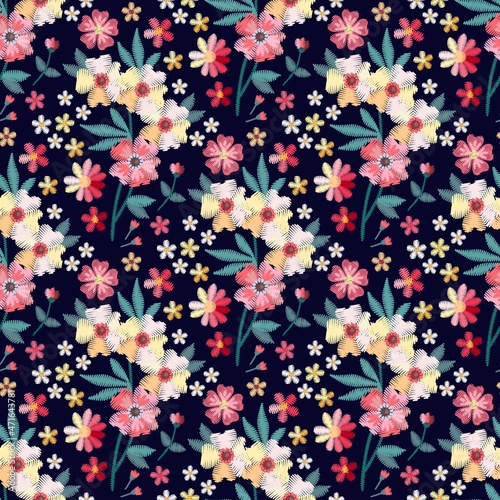 Embroidered seamless pattern with colorful flowers on black background. Print for fabric, textile, wrapping paper. Beautiful floral embroidery.