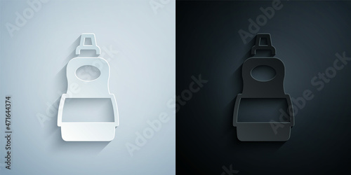 Paper cut Dishwashing liquid bottle icon isolated on grey and black background. Liquid detergent for washing dishes. Paper art style. Vector
