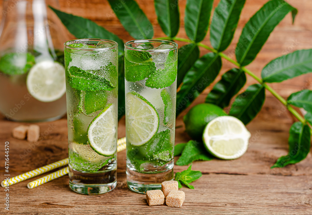 Fototapeta premium Refreshing summer drink with lime, ice and mint. Close up, copy space