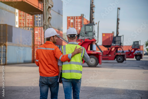 Staff of import and export industries inspect logistic freight containers. 