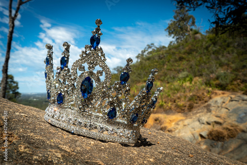 A crown on the rocks near a waterfall in the Australian bush