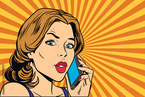 short-haired young woman talking on the smartphone.