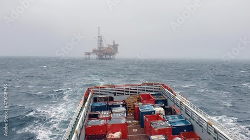 Platform supply vessel PSV near Oil Rig and drilling platform