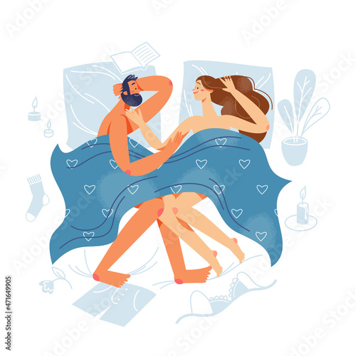 Happy couple of lovers laying in bed together, woman and man looking at each other