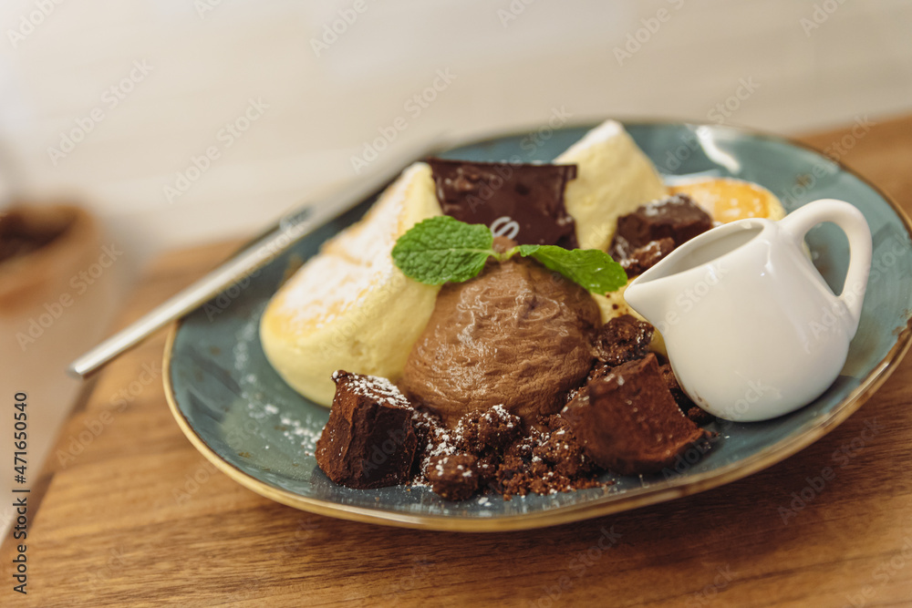 chocolate souffle with cream and sauce
