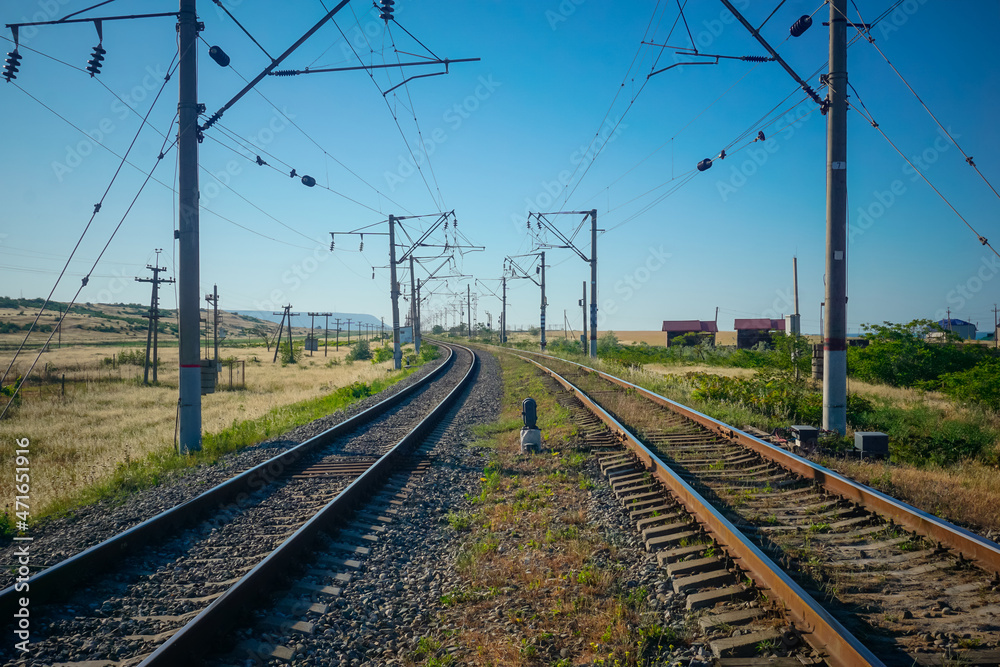 Two railway tracks stretching beyond the horizon