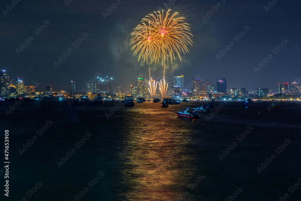 fantastic and colorful fireworks display over the night sky of the city during a festival