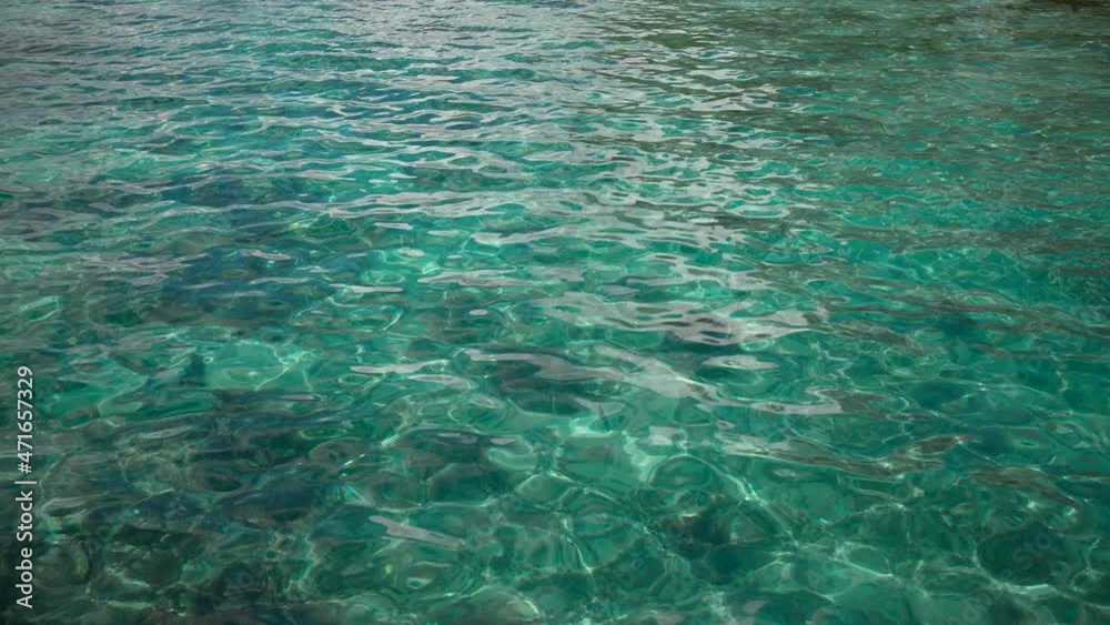 Crystal clear water light creates a beautiful veil, consisting of sunlight. Ocean waves oscillate and flow with the rays of light. Super slow motion 4K shot Crystal clear water light creates a beautiful veil, consisting of sunlight. Ocean waves oscillate and flow with the rays of light. Super slow motion 4K shot