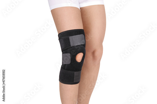 Картината върху платно Knee Support Brace on leg isolated on white background