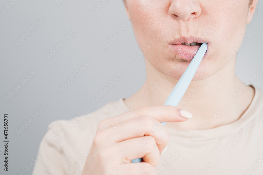 Close-up portrait of caucasian woman brushing her teeth. The girl performs the morning oral hygiene procedure Close-up portrait of caucasian woman brushing her teeth. The girl performs the morning oral hygiene procedure
