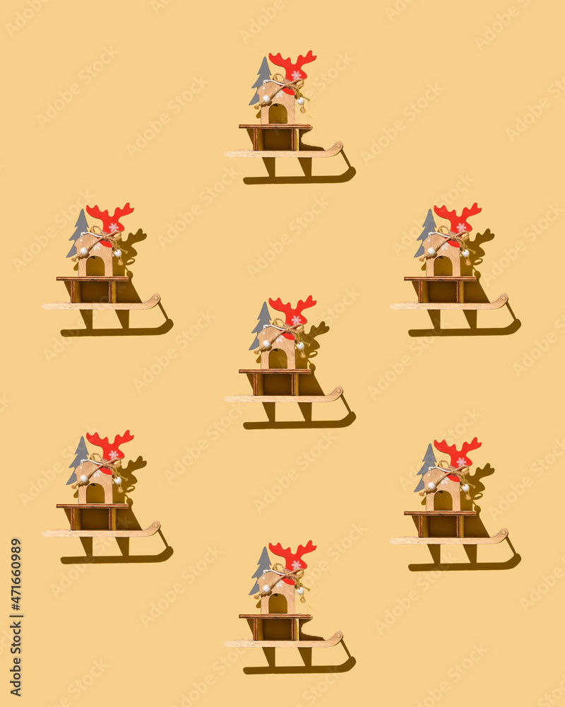 Christmas reindeer pattern, wooden christmas decoration reindeer sled with christmas tree. Flat lay top view. Reindeer with antlers as announcers of the winter holiday season. Santa Claus helpers.