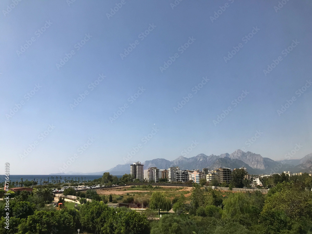 Skyline of Providencia district in Santiago de Chile with snowed Andes mountain range in the background. This is a wealthy residential and commercial district in the city