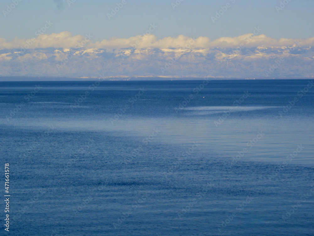 Velebit mountain covered with clouds, view from Adriatic Sea