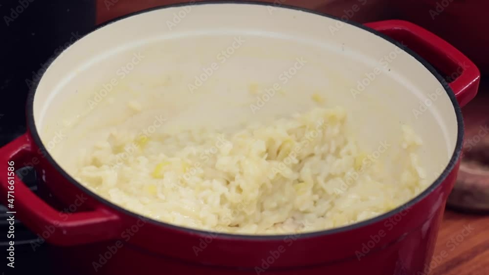 Preparing food. Picking up risotto from the pan. Preparing food. Picking up risotto from the pan.
