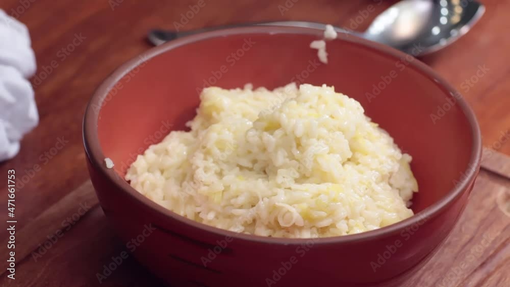 Preparing food. Putting risotto out of the bowl. Preparing food. Putting risotto out of the bowl.