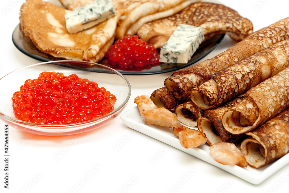 Russian pancakes and red caviar on a white background