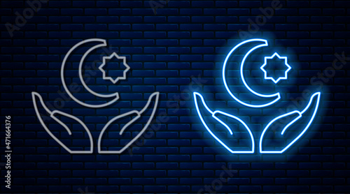 Glowing neon line Star and crescent - symbol of Islam icon isolated on brick wall background. Religion symbol. Vector