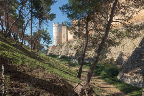 Lucera, Foggia. Exterior with the cylindrical tower of the Fortezza Svevo-Angioina, commissioned by Frederick II, Holy Roman Emperor following his decision to lead the Saracens rebels of Sicily  photo